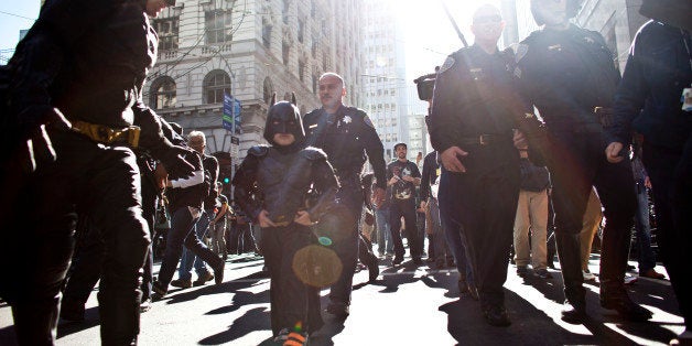 SAN FRANCISCO, CA - NOVEMBER 15: Police escorts leukemia survivor Miles, 5, dressed as BatKid, and Batman after they arrest t