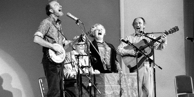 CORRECTS THE FIRST NAME OF GILBERT'S PARTNER TO DONNA - FILE - In this Nov. 28, 1980, file photo, The Weavers perform in a 25th Anniversary reunion concert at Carnegie Hall in New York. From left are: Pete Seeger, Lee Hays, Ronnie Gilbert and Fred Hellerman. Ronnie Gilbert has died. She was 88. Her longtime partner, Donna Korones, says Gilbert died of natural causes Saturday, June 6, 2015, at a retirement community in Mill Valley, Calif. (AP Photo/Richard Drew, File)