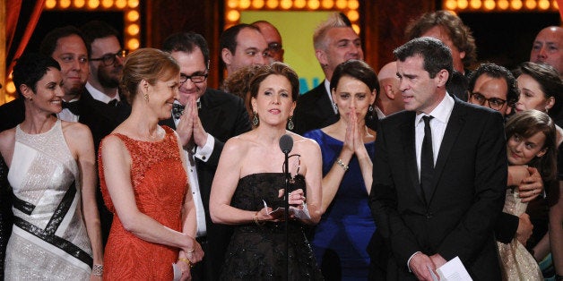 Kristin Caskey, center, along with cast and crew accepts the award for best musical for âFun Homeâat the 69th annual Tony Awards at Radio City Music Hall on Sunday, June 7, 2015, in New York. (Photo by Charles Sykes/Invision/AP)