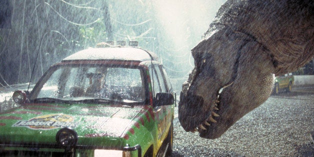 A Tyrannosaurus Rex menaces the theme park's first customers in a scene from the film 'Jurassic Park', 1993. (Photo by Murra