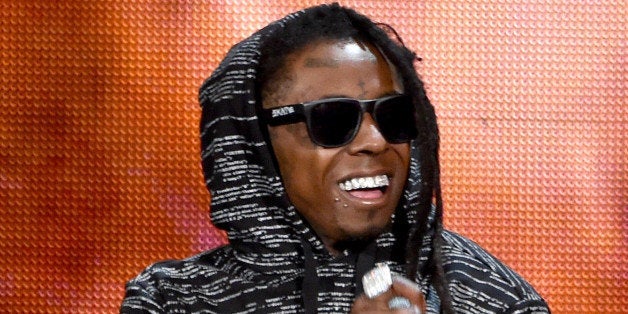 LOS ANGELES, CA - NOVEMBER 23: Recording artist Lil Wayne performs onstage at the 2014 American Music Awards at Nokia Theatr
