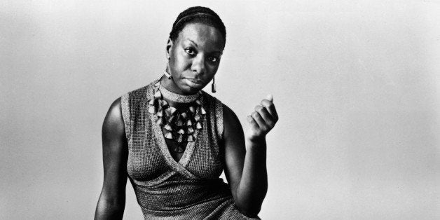 UNSPECIFIED - 1968: This studio portrait shows American pianist and jazz singer Nina Simone reclining on the floor circa 1968