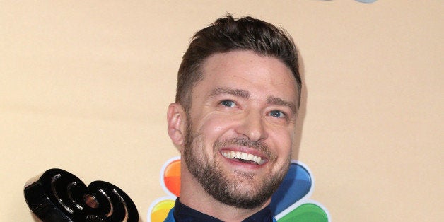 Justin Timberlake poses in the press room with the iHeartRadio Innovator award at the iHeartRadio Music Awards at The Shrine