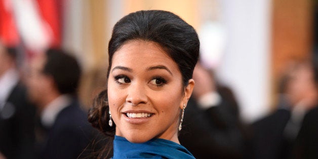 Gina Rodriguez arrives at the Oscars on Sunday, Feb. 22, 2015, at the Dolby Theatre in Los Angeles. (Photo by Chris Pizzello/