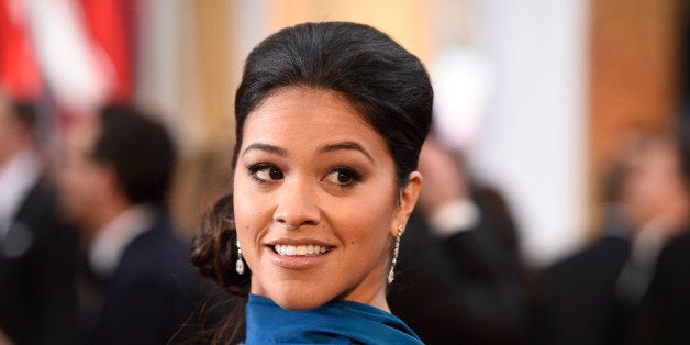 Gina Rodriguez arrives at the Oscars on Sunday, Feb. 22, 2015, at the Dolby Theatre in Los Angeles. (Photo by Chris Pizzello/Invision/AP)