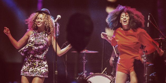 INDIO, CA - APRIL 12: (EDITORS NOTE: Image was processed using Digital Filters) Singer Beyonce (L) performs with her sister Solange onstage during day 2 of the 2014 Coachella Valley Music & Arts Festival at the Empire Polo Club on April 12, 2014 in Indio, California. (Photo by Christopher Polk/Getty Images for Coachella)
