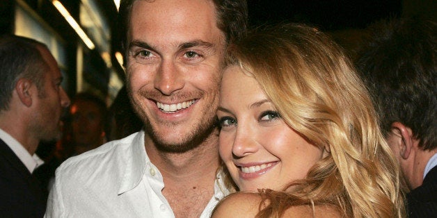 LOS ANGELES - AUGUST 2: Actors Oliver Hudson and his sister Kate Hudson pose at the afterparty for the premiere of Universal