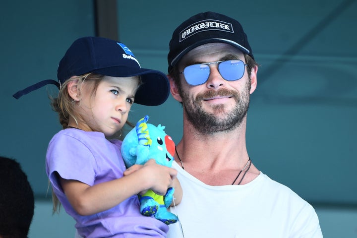 Actor Chris Hemsworth, holding daughter India Rose Hemsworth on the Gold Coast, Australia, in April, told GQ Australia his acting has "suffered" with fatherhood. 