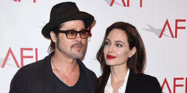 Brad Pitt, left, and Angelina Jolie arrive at the AFI Awards at The Four Seasons Hotel on Friday, Jan. 9, 2015 in Los Angeles. (Photo by Jordan Strauss/Invision/AP)