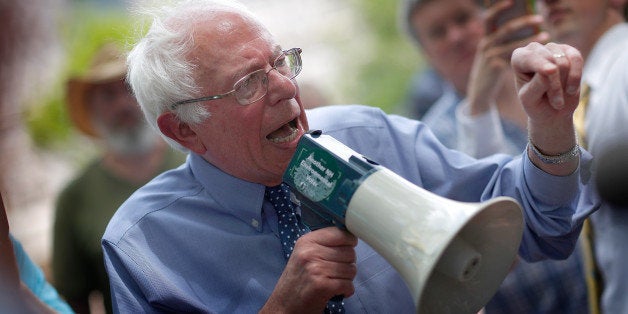 CONCORD, NH - MAY 27: Democratic presidential candidate and U.S. Sen. Bernie Sanders (I-VT) speaks to an overflow crowd through a megaphone after a campaign event at the New England College May 27, 2015 in Concord, New Hampshire. Sanders officially declared his candidacy yesterday and will run as a Democrat in the presidential election and is former Secretary of State Hillary ClintonÃs first challenger for the Democratic nomination. (Photo by Win McNamee/Getty Images)