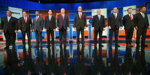 Republican presidential candidates from left, Chris Christie, Marco Rubio, Ben Carson, Scott Walker, Donald Trump, Jeb Bush, Mike Huckabee, Ted Cruz, Rand Paul, and John Kasich take the stage for the first Republican presidential debate at the Quicken Loans Arena, Thursday, Aug. 6, 2015, in Cleveland. (AP Photo/Andrew Harnik)