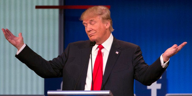 Republican presidential candidate Donald Trump gestures during the first Republican presidential debate at the Quicken Loans Arena Thursday, Aug. 6, 2015, in Cleveland. (AP Photo/John Minchillo)