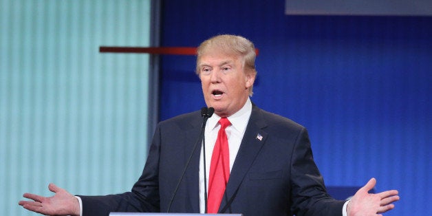 CLEVELAND, OH - AUGUST 06: Republican presidential candidate Donald Trump fields a question during the first Republican presidential debate hosted by Fox News and Facebook at the Quicken Loans Arena on August 6, 2015 in Cleveland, Ohio. The top ten GOP candidates were selected to participate in the debate based on their rank in an average of the five most recent political polls. (Photo by Scott Olson/Getty Images)