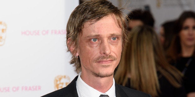 Mackenzie Crook poses for photographers upon arrival at the BAFTA Television awards in central London, Sunday, May 10, 2015. (Photo by Jonathan Short/Invision/AP)