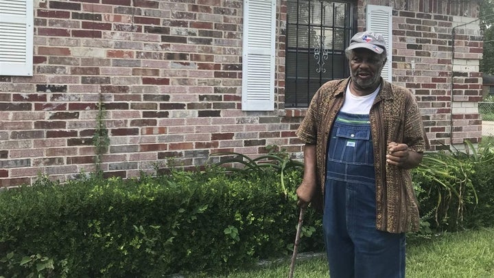 Johnnie Armstrong, 80, stands outside his home in Joppa, a historically black neighborhood in South Dallas. He bought his hou