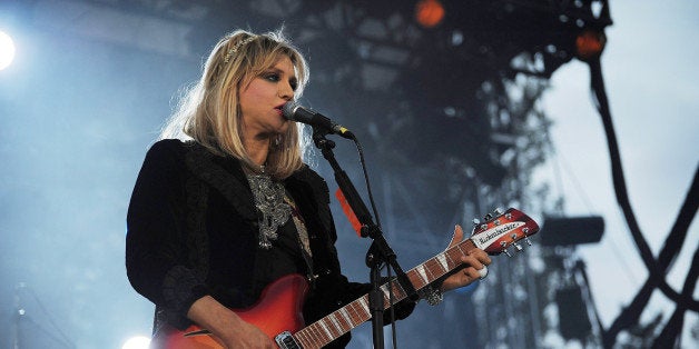 SEATTLE - SEPTEMBER 05: Singer and guitar player Courtney Love of Hole peforms on the Mainstage at Bumbershoot on September 5, 2010 in Seattle, Washington. (Photo by Dana Nalbandian/WireImage)