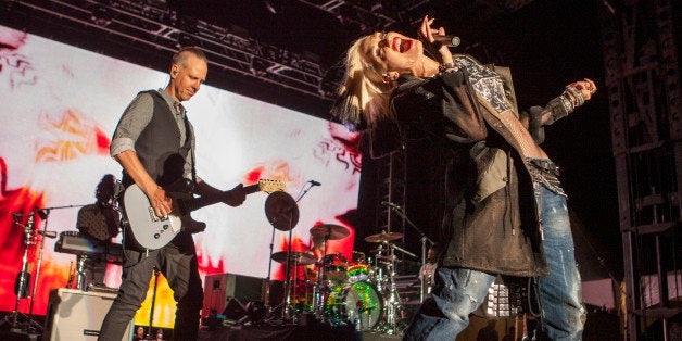 Tom Dumont and Gwen Stefani of No Doubt seen at Riot Fest & Carnival in Douglas Park on Friday, Sept. 11, 2015 in Chicago. (Photo by Barry Brecheisen/Invision/AP)