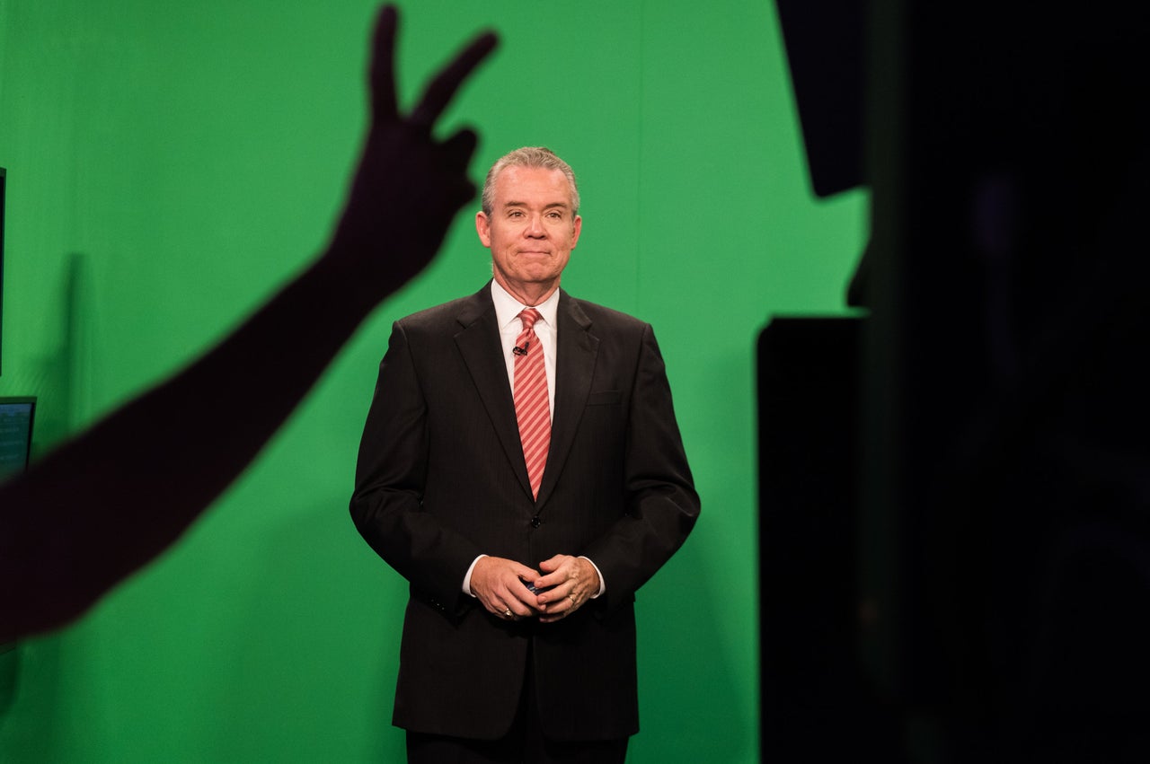 A stage manager at NBC-6 gives a countdown before Morales starts his evening weather segment.