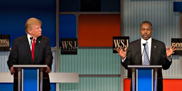 2016 Republican presidential candidates Donald Trump, president and chief executive of Trump Organization Inc., left, and Ben Carson, a retired neurosurgeon, participate in a presidential candidate debate in Milwaukee, Wisconsin, U.S., on Tuesday, Nov. 10, 2015. The fourth Republican debate, hosted by Fox Business Network and the Wall Street Journal, focuses on the economy with eight presidential candidates included in the main event and four in the undercard version. Photographer: Daniel Acker/Bloomberg via Getty Images