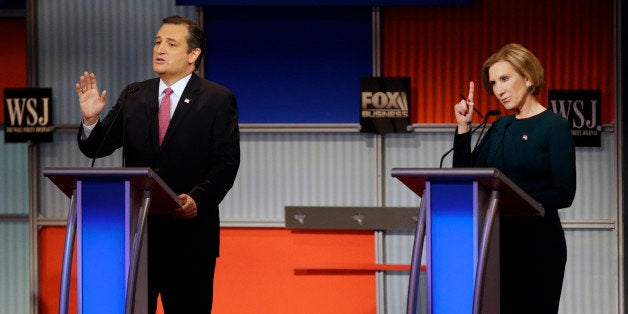 Ted Cruz speaks as Carly Fiorina tries to make a comment during a Republican presidential debate at the Milwaukee Theatre, Tuesday, Nov. 10, 2015, in Milwaukee. (AP Photo/Jeffrey Phelps)