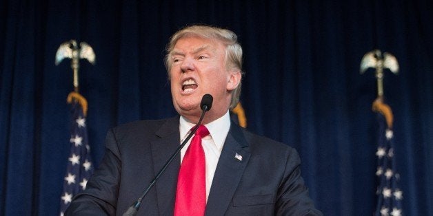 US Republican presidential candidate Donald Trump addresses a campaign rally in Manassas, Virginia, on December 2, 2015. AFP PHOTO/NICHOLAS KAMM / AFP / NICHOLAS KAMM (Photo credit should read NICHOLAS KAMM/AFP/Getty Images)