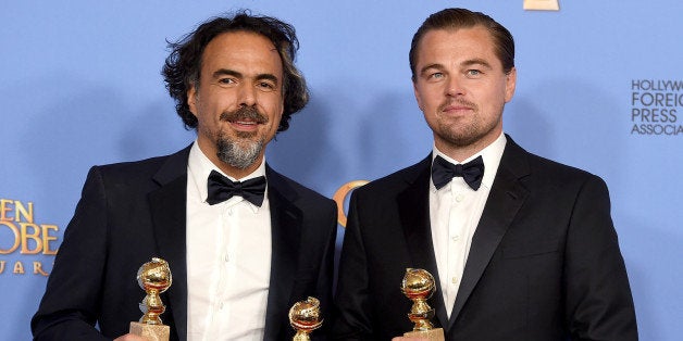 Alejandro Gonzalez Inarritu, left, and Leonardo DiCaprio pose in the press room with the award for best motion picture - dram