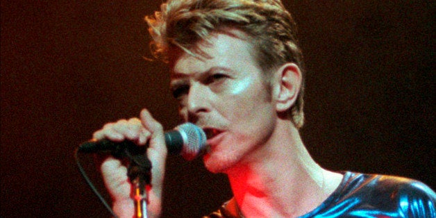 CORRECTS DATE OF DEATH TO SUNDAY, JAN. 10, 2016 - FILE - In this Sept. 14, 1995, file photo, David Bowie performs during a concert in Hartford, Conn. Bowie, the innovative and iconic singer whose illustrious career lasted five decades, died Sunday, Jan. 10, 2016, after battling cancer for 18 months. He was 69. (AP Photo/Bob Child, File)