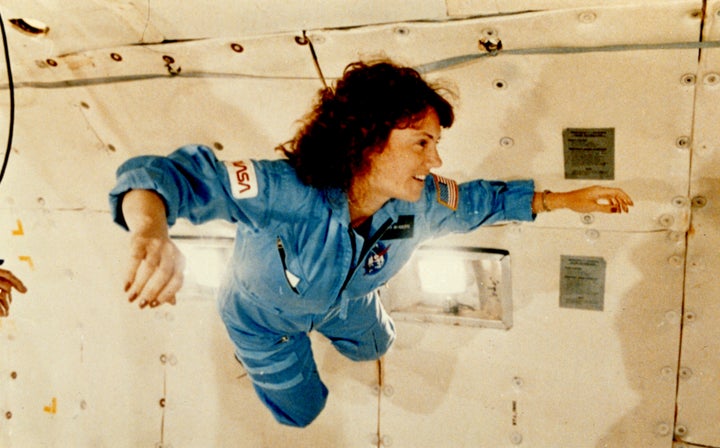 Christa McAuliffe suspends in the air during a training exercise on a