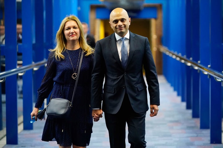 <strong>Home Secretary Sajid Javid arrives with his wife Laura Javid ahead of May's conference speech</strong>