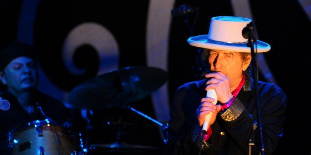 Singer Bob Dylan (R) performs during his show in Vietnam's southern Ho Chi Minh city April 10, 2011. Dylan is in Vietnam for