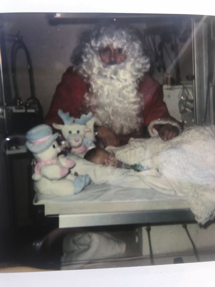 Baby Leah Aldridge being visited by Father Christmas in hospital