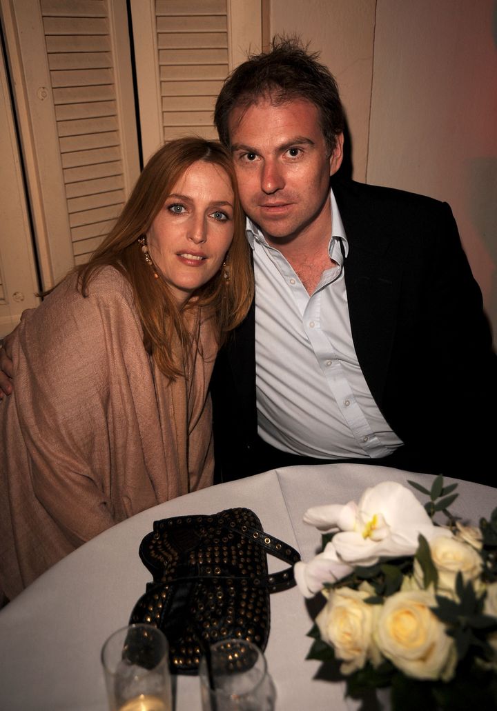 CANNES, FRANCE - MAY 15: Actress Gillian Anderson (L) and Mark Griffiths attend the AKVINTA GQ Party for How to Lose Friends & Alienate People Premiere at the Festival House, Villa Khayat during the 61st Cannes International Film Festival on May 15, 2008 in Cannes, France. (Photo by George Pimentel/WireImage) 