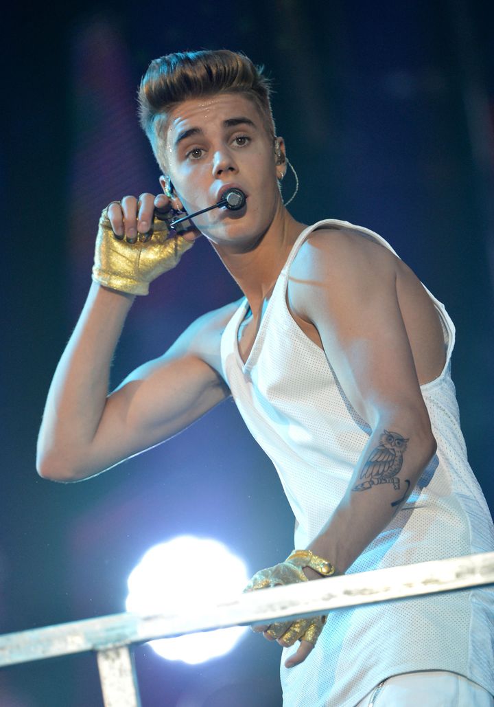 Canadian singer Justin Bieber performs during a concert as part of his 'I Believe' tour at the Palais Omnisport de Paris-Bercy (POPB), on March 19, 2013. AFP PHOTO / MIGUEL MEDINA (Photo credit should read MIGUEL MEDINA/AFP/Getty Images)