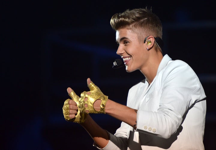 Canadian singer Justin Bieber performs during a concert as part of his 'I Believe' tour at the Palais Omnisport de Paris-Bercy (POPB), on March 19, 2013. AFP PHOTO / MIGUEL MEDINA (Photo credit should read MIGUEL MEDINA/AFP/Getty Images)