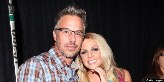 LAS VEGAS, NV - SEPTEMBER 21: Jason Trawick and his wife, singer Britney Spears, pose backstage during the 2012 iHeartRadio