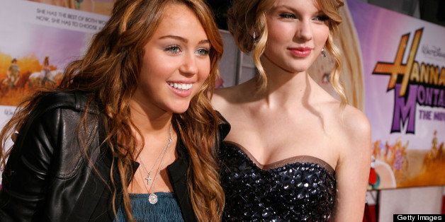 HOLLYWOOD - APRIL 02: Actress/singer Miley Cyrus (L) and singer Taylor Swift arrive at the premiere of Walt Disney Picture's 'Hannah Montana: The Movie' held at the El Captian Theatre on April 2, 2009 in Hollywood, California. (Photo by Jeff Vespa/WireImage) 
