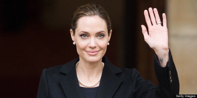 US actress and humanitarian campaigner Angelina Jolie leaves Lancaster House in central London on April 11, 2013 after speaking during an announcement of funding to address conflict sexual violence on the sidelines of the G8 Foreign Ministers meeting. British Foreign Secretary William Hague and Angelina Jolie spoke at the G8 Foreign Minister?s meeting to announce 10 million GBP (15,340,000 USD) funding to support efforts to tackle sexual violence in conflict and violence against women and girls (VAWG). AFP PHOTO / LEON NEAL (Photo credit should read LEON NEAL/AFP/Getty Images)