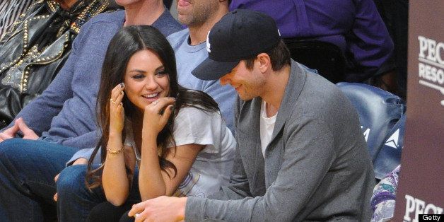 LOS ANGELES, CA - FEBRUARY 12: Mila Kunis (L) and Ashton Kutcher attend a basketball game between the Phoenix Suns and the Los Angeles Lakers at Staples Center on February 12, 2013 in Los Angeles, California. (Photo by Noel Vasquez/Getty Images)