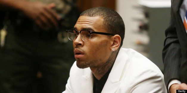 LOS ANGELES, CA - JUNE 10: Recording artist Chris Brown listens to the judge during his court appearance on June 10, 2013 in Los Angeles, California. Brown appeared in court for a probation review hearing related to the 2009 domestic violence case in which he pleaded guilty to assaulting his then-girlfriend, singer Rihanna. (Photo by Frederick M. Brown/Getty Images)