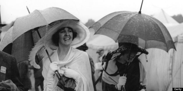 June 1922: First day fashions at Ascot get caught in the rain. (Photo by Topical Press Agency/Getty Images)