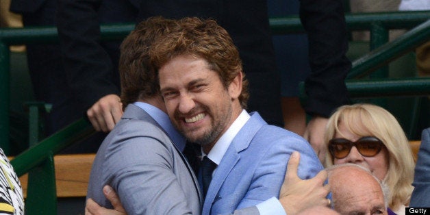 LONDON, ENGLAND - JULY 07: Bradley Cooper and Gerard Butler attend the Men's Singles Final between Novak Djokovic and Andy Murray on Day 13 of the Wimbledon Lawn Tennis Championships at the All England Lawn Tennis and Croquet Club on July 7, 2013 in London, England. (Photo by Karwai Tang/WireImage)