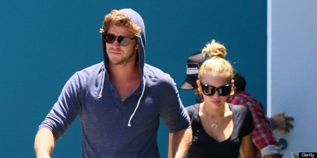 LOS ANGELES, CA - JULY 16: Miley Cyrus and Liam Hemsworth are seen on Melrose Blvd. on July 16, 2012 in Los Angeles, California. (Photo by JB Lacroix/WireImage)
