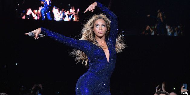 MIAMI, FL - JULY 10: Entertainer Beyonce performs on stage during 'The Mrs. Carter Show World Tour' at the American Airlines Arena on July 10, 2013 in Miami, Florida. Beyonce wore a royal blue hand-beaded jumpsuit by Vrettos Vrettakos, Stuart Weitzman shoes and hosiery by Capezio. (Photo by Larry Busacca/PW/WireImage for Parkwood Entertainment)