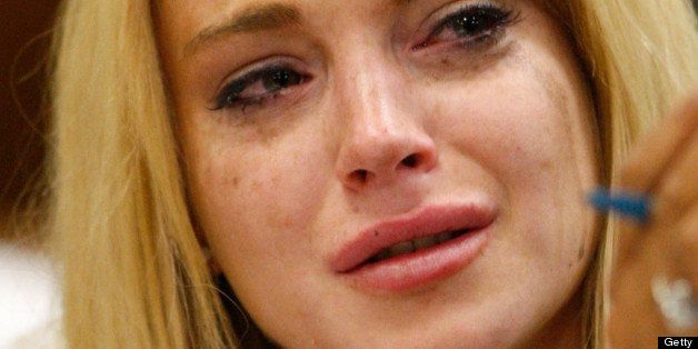 LOS ANGELES, CA - JULY 06: Actress Lindsay Lohan cries during her probation revocation hearing at the Beverly Hills Courthouse on July 6, 2010 in Los Angeles, California. Lindsay Lohan was put on probation for her August 2007 no-contest plea to drug and alcohol charges stemming from two separate traffic accidents, but the probation was revoked in May 2010 after missing a scheduled hearing. (Photo by David McNew/Getty Images)
