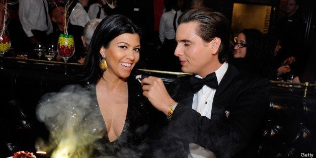 LAS VEGAS, NV - DECEMBER 31: (EXCLUSIVE COVERAGE) Television personalities Kourtney Kardashian (L) and Scott Disick celebrate New Year's Eve at the Sugar Factory American Brasserie at the Paris Las Vegas on December 31, 2011 in Las Vegas, Nevada. (Photo by David Becker/WireImage)