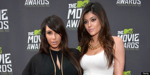 CULVER CITY, CA - APRIL 14: TV personalities Kim Kardashian (L) and Kylie Jenner arrive at the 2013 MTV Movie Awards at Sony Pictures Studios on April 14, 2013 in Culver City, California. (Photo by Alberto E. Rodriguez/Getty Images)