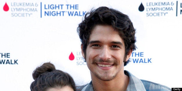 UNIVERSAL CITY, CA - JULY 27: Actor Tyler Posey (R) and guest attend Variety's Power of Youth presented by Hasbro, Inc. and generationOn at Universal Studios Backlot on July 27, 2013 in Universal City, California. (Photo by Ari Perilstein/Getty Images for Variety)