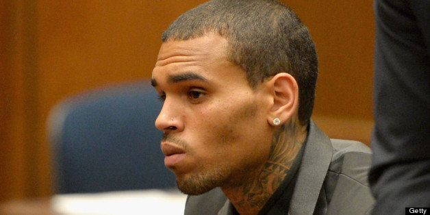 LOS ANGELES, CA - JULY 15: Recording artist Chris Brown during is court appearance on July 15, 2013 in Los Angeles, California. Brown appeared in court for a probation review hearing related to the 2009 domestic violence case in which he pleaded guilty to assaulting his then-girlfriend singer Rihanna. (Photo by Alberto E. Rodriguez/Getty Images)