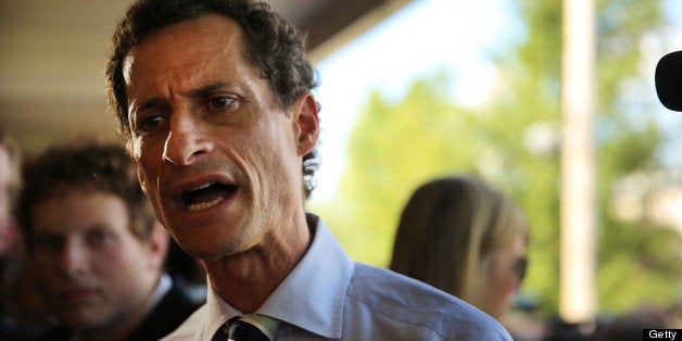 NEW YORK, NY - JULY 26: Anthony Weiner, a leading candidate for New York City mayor, speaks with residents in Staten Island on a visit to homes damaged by Hurricane Sandy on July 26, 2013 in New York City. It was recently revealed that Weiner engaged in lewd online conversations with a woman after he resigned from Congress for similar previous incidents. (Photo by Spencer Platt/Getty Images)