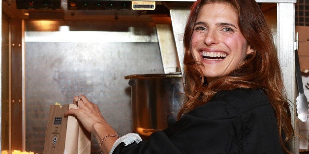 NEW YORK, NY - AUGUST 09: Actress/director Lake Bell (R) serves popcorn at the 'In A World...' New York Screening at Landma